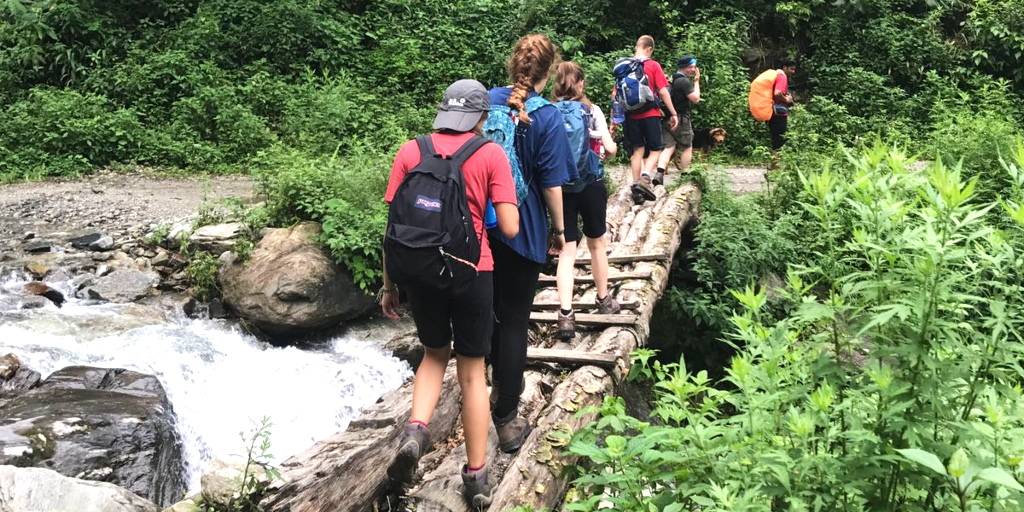 GVI participants walk through the rainforest. 