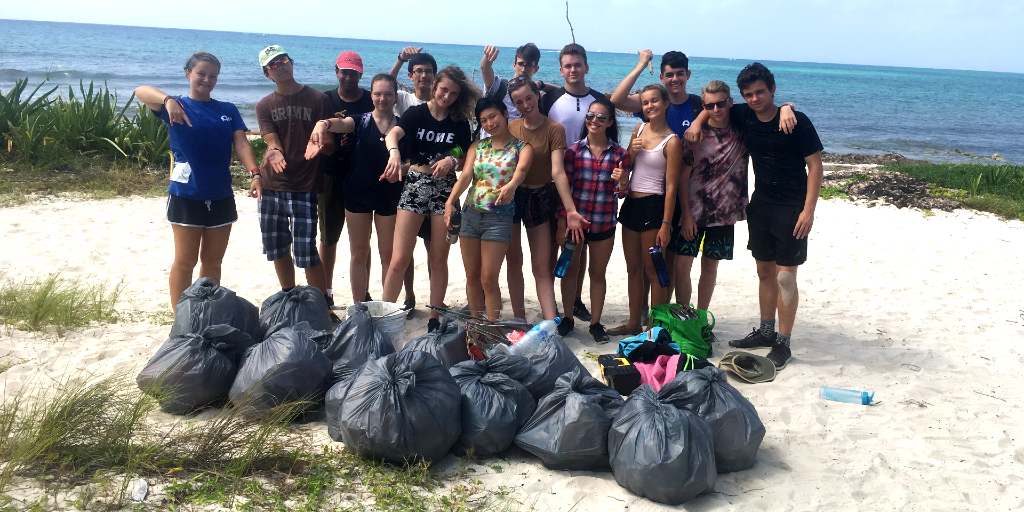 GVI 15 year olds participate in a beach clean up. 