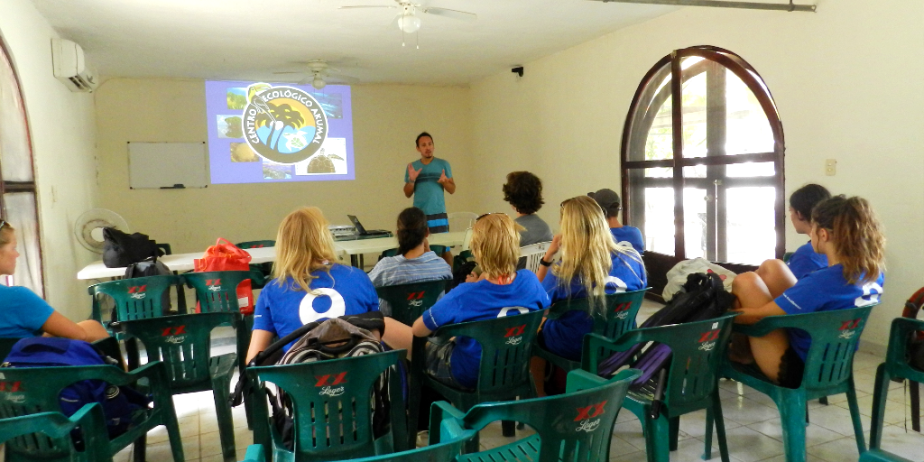 GVI participants sit through an educational class. 