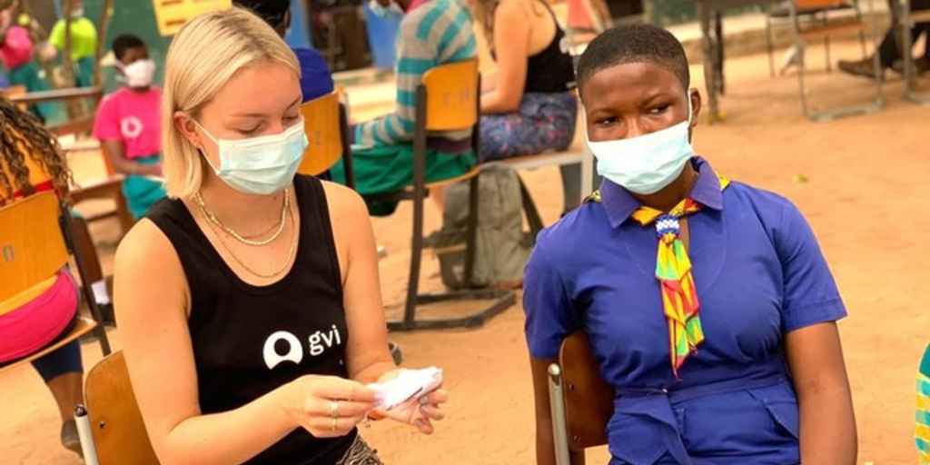 A GVI volunteer is involved in a volunteer abroad program and follows covid-19 protocols. 